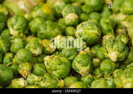 Green Brussels sprouts or little cabbages broccoli in a farmer agricultural street market ready to be sold Stock Photo