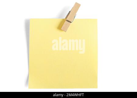 Wooden clothespin and yellow paper notes isolated on white background Stock Photo