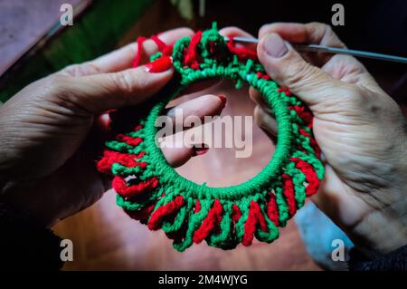 Kathmandu, Bagmati, Nepal. 23rd Dec, 2022. A woman prepares a crochet decorative item in celebration of Christmas at a local home in Kathmandu, Nepal on December 23, 2022. (Credit Image: © Sunil Sharma/ZUMA Press Wire) Credit: ZUMA Press, Inc./Alamy Live News Stock Photo