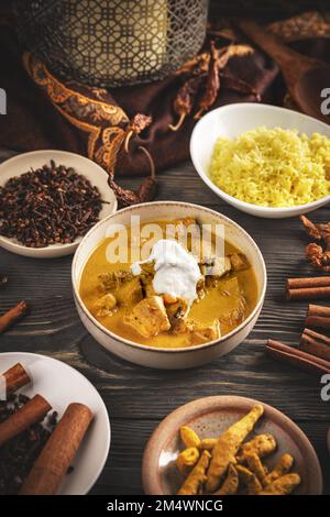 Indian Butter chicken with basmati rice in bowl Stock Photo
