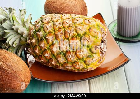 yellow pineapple on wood background Stock Photo
