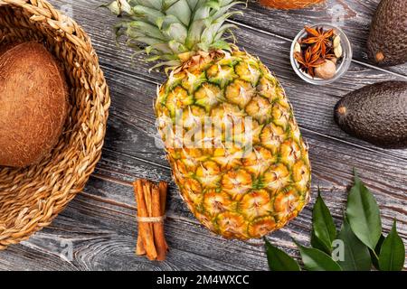 yellow pineapple on wood background Stock Photo