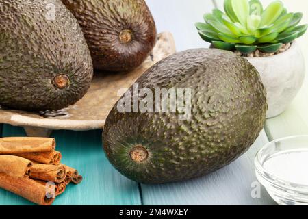 hass avocado on wood background Stock Photo