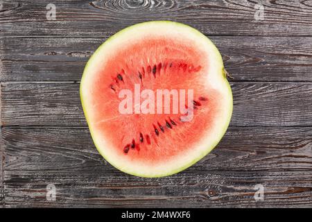sliced watermelon on wood background Stock Photo