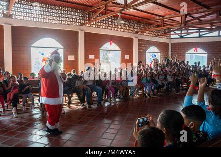 Santa in the streets (Santa en las calles), after 2 years of not being able to celebrate this solidarity project that provides moments of happiness to Stock Photo