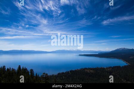 A beautiful summer day overlooking Lake Tahoe in the Sierra Nevada Mountains from high summit peak. Lake Tahoe, California Stock Photo