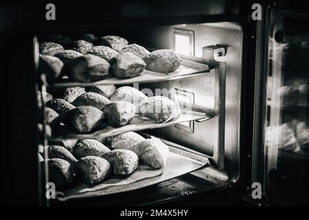 Pastry, cookies, croissants, baguette and bread are being made Stock Photo