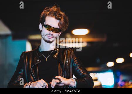 Young man wearing smart glasses and leather jacket Stock Photo