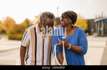 Happy senior couple talking to each other Stock Photo