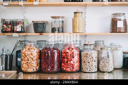 Dried fruits arranged on display in zero waste shop Stock Photo