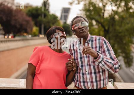 Senior couple wearing smart glasses Stock Photo