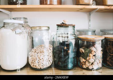 Dried food in jars at zero waste store Stock Photo