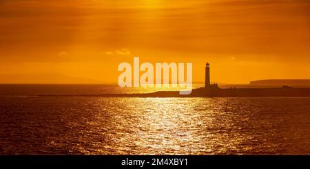 UK, Scotland, Sanday, Panoramic view of Start Point Lighthouse at moody dusk Stock Photo