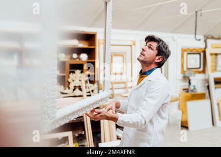 Mature carpenter working in workshop Stock Photo