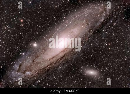 Andromeda galaxy surrounded by stars in sky Stock Photo