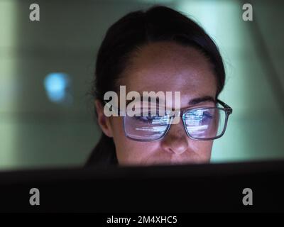 Focused programmer working on computer Stock Photo