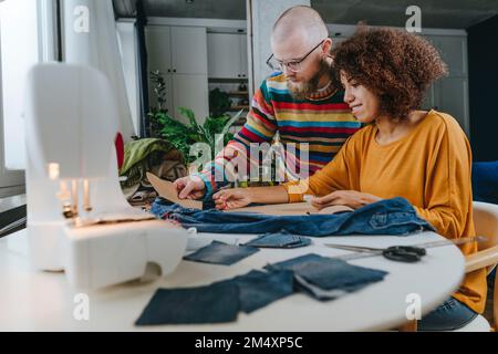 Fashion designers working together in workshop Stock Photo