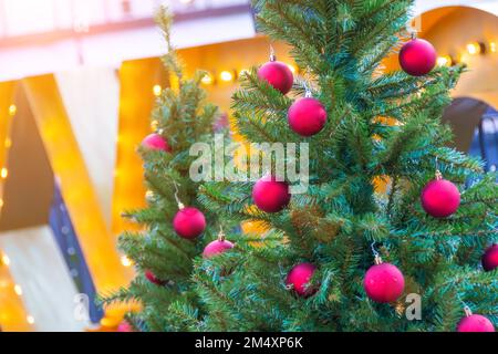 Red Christmas toys balls decorations on Christmas trees Stock Photo