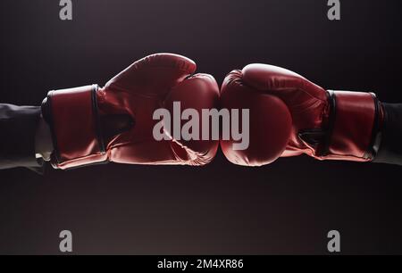 Two men's hands in boxing gloves. Confrontation concept Stock Photo