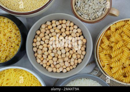 Chickpeas in bowl. Various vegetarian organic products. Vintage view. Top view. Stock Photo