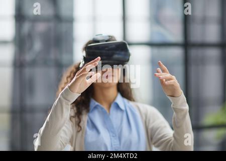 positive woman wearing virtual reality goggles headsetConnection, technology, new generation, progress concept. Stock Photo
