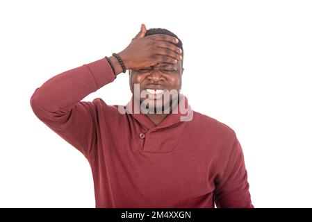 portrait of a handsome young man suffering from headache. Stock Photo