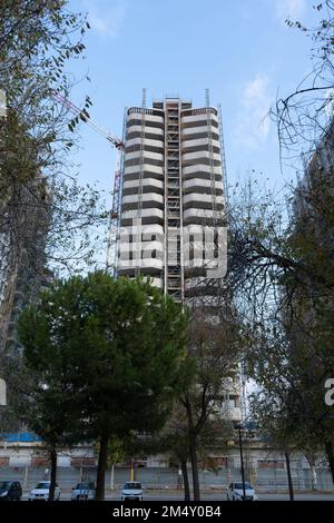 Valencia, Spain - December 19, 2021: A buildings under construction next to a park in a new neighborhood of the city Stock Photo