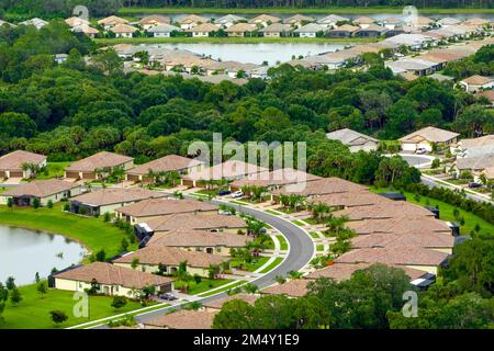 Aerial view of tightly located family houses in Florida closed suburban area. Real estate development in american suburbs Stock Photo