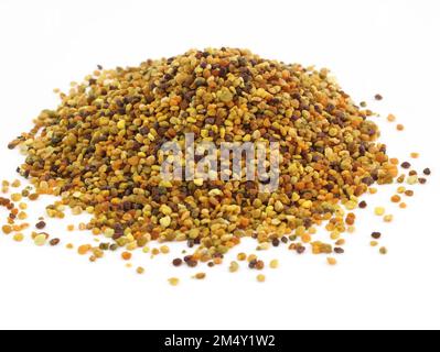 Flower pollen grains or bee bread. Pile of bee pollen or perga on white background top view. Healthy vegetarian food supplement. Stock Photo