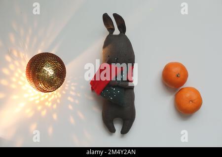 Toy rabbit - symbol of the Chinese New Year. Gift and decorations. Christmas, winter, happy New Year 2023 concept Stock Photo