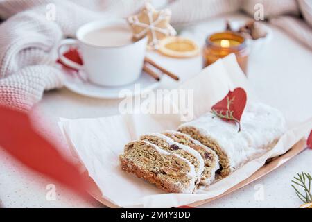 Aesthetic traditional Christmas breakfast. German stollen cake, coffee, cookies. Happy holidays Stock Photo