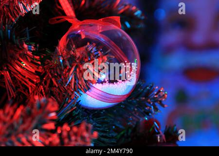Close up Decoration for the Christmas tree. Decoration for the Christmas tree, Santa in the back is blurred. Stock Photo