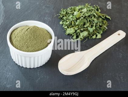 Moringa oleifera medicinal plant - moringa powder and dried leaves. Stock Photo