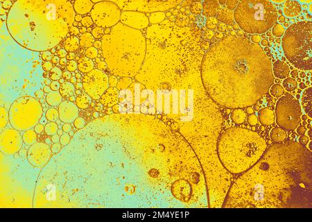 Oil bubbles inside water base form patterns Stock Photo