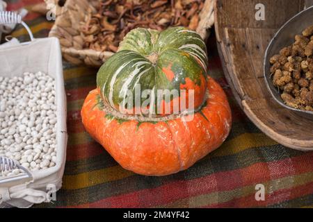 A unique half orange half green pumpkin in display Stock Photo