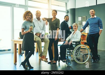 Theyre a diverse and dynamic team. Portrait of a group of businesspeople in an office. Stock Photo