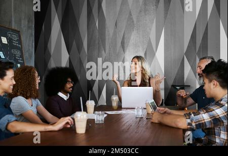 Shes got a plan. a group of designers having a meeting in their creative office. Stock Photo