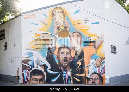 Buenos Aires, Argentina. 23rd Dec, 2022. A mural of Messi lifting the world cup in Buenos Aires. The Argentine artist, Maximiliano Bagnasco is the first to capture Argentina's triumph in Qatar 2022 in a mural where Lionel Messi is seen lifting the FIFA World Cup in the Palermo neighborhood, Buenos Aires. Credit: SOPA Images Limited/Alamy Live News Stock Photo