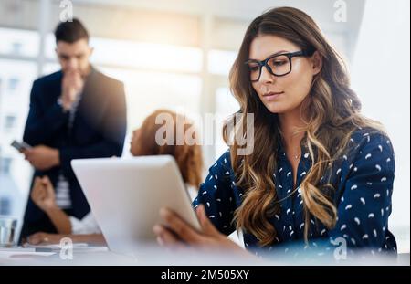 She works hard for her team. creative employees working in a modern office. Stock Photo