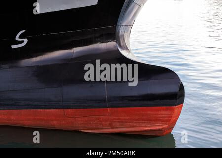 Bulbous bow of an industrial ship. This is a protruding bulb at the bow of a ship reducing drag and thus increasing speed, range, fuel efficiency, and Stock Photo