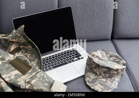 cropped view of soldier camouflage uniform laptop Stock Photo
