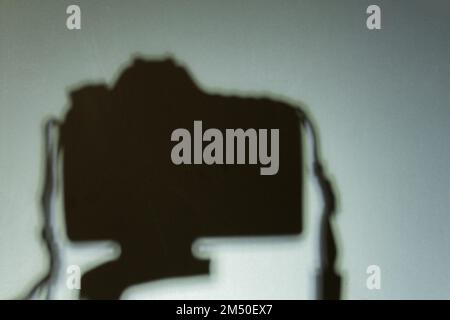 shadow camera on a tripod in a room Stock Photo