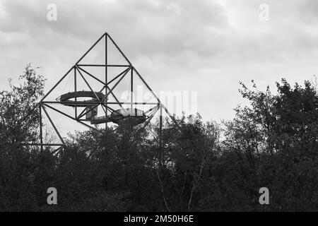 A grayscale of Tetrahedron, accessible viewing terrace Emscherblick in shape of a pyramid on slagheap Stock Photo