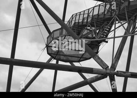 A grayscale of Tetrahedron, accessible viewing terrace Emscherblick in shape of a pyramid on slagheap Stock Photo