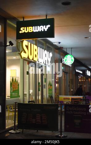 Subway and Starbucks signs on Station Square at Milton Keynes railway station. Stock Photo