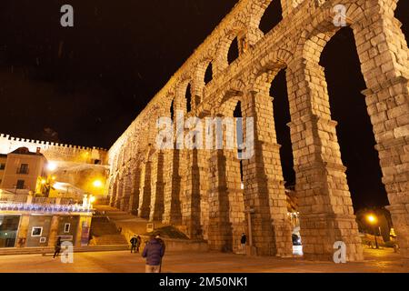 Segovia, Spain - 4 January 2022: Close-up view of acueducto of Segovia with night illumination Stock Photo