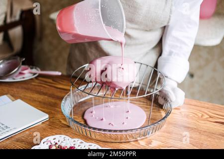 Valentines Day Cupcakes and Cake Recipes Ideas. Valentines Day heart shape pink Mirror Glaze mousse homemade cake on home kitchen Stock Photo
