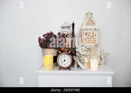 https://l450v.alamy.com/450v/2m50yme/home-decoration-accessories-eiffel-statue-fairy-statue-white-lantern-alarm-clock-and-artificial-plant-2m50yme.jpg
