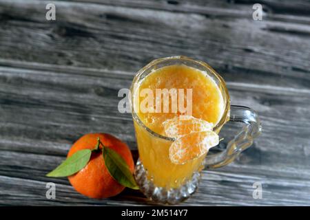 Tangerine Juice, The mandarin orange (Citrus reticulata), also known as the mandarin or mandarine, a small citrus tree fruit. Treated as a distinct sp Stock Photo