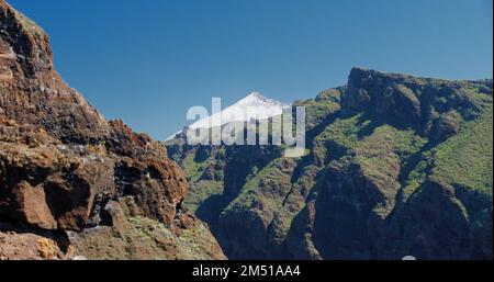 Teide, Tenerife, Canary Islands, Spain. View of the peak of the snowy Mount Teide. Pico del Teide, Tenerife, Canary Islands, Spain. From Masca Gorge. Stock Photo